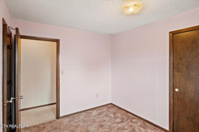 716 Lakewood Dr, Jefferson City, TN 37760 - spare room featuring carpet flooring, a textured ceiling, and baseboards