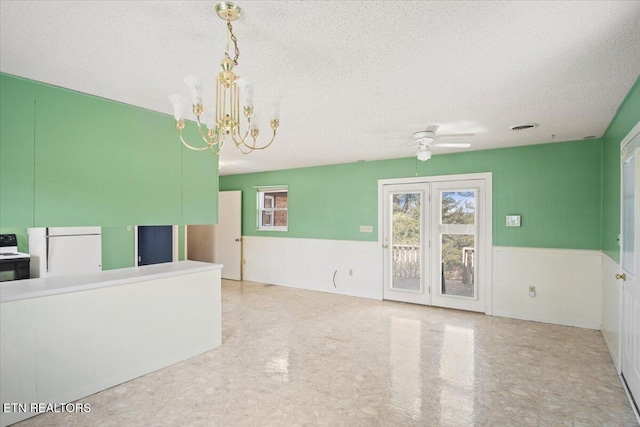 716 Lakewood Dr, Jefferson City, TN 37760 - interior space featuring a textured ceiling, wainscoting, and ceiling fan with notable chandelier