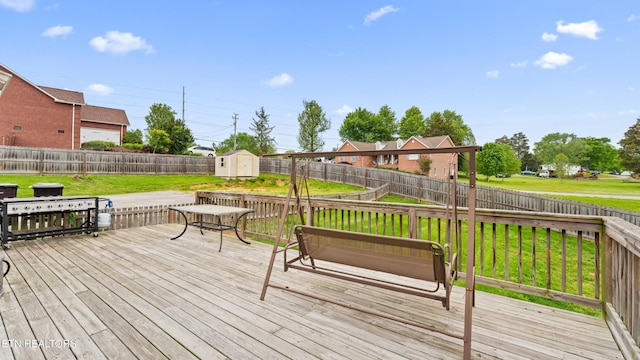 7424 Castlegate Blvd, Knoxville, TN 37918 - wooden terrace with a yard, an outdoor structure, a fenced backyard, and a storage unit