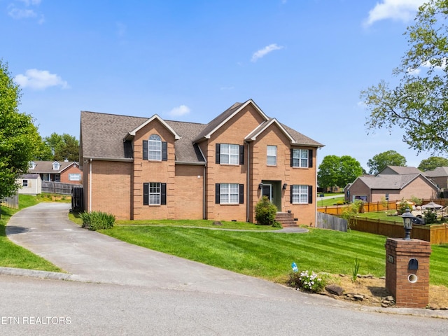 7424 Castlegate Blvd, Knoxville, TN 37918 - view of front facade featuring brick siding, fence, and a front lawn