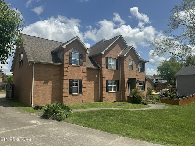 7424 Castlegate Blvd, Knoxville, TN 37918 - view of front facade featuring brick siding, roof with shingles, and a front lawn