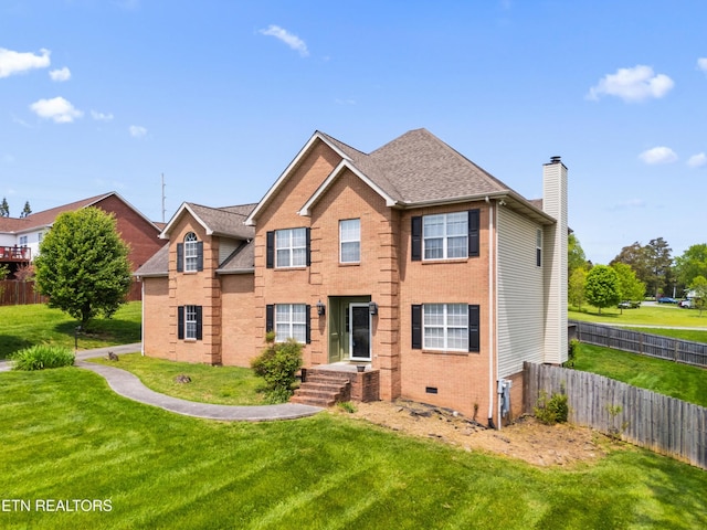 7424 Castlegate Blvd, Knoxville, TN 37918 - view of front of house with fence, a chimney, a front yard, and brick siding