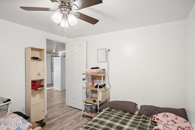 bedroom with ceiling fan and wood finished floors