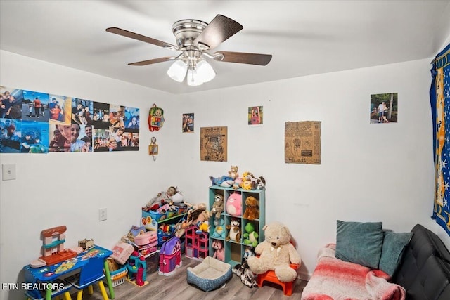 game room with ceiling fan and wood finished floors