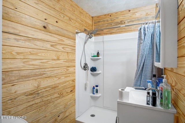full bathroom featuring wood walls, toilet, and a shower stall