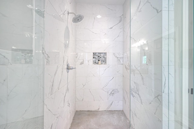 full bath with tiled shower