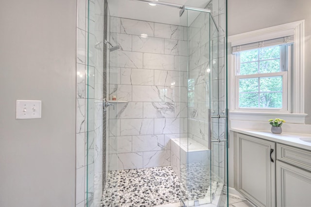 bathroom featuring vanity and a shower stall