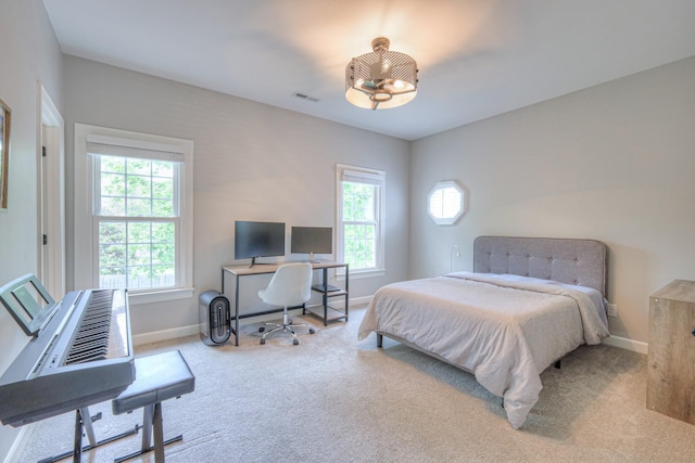 bedroom with carpet flooring, baseboards, and visible vents