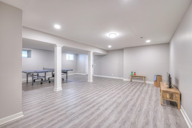 basement with baseboards, plenty of natural light, recessed lighting, and wood finished floors