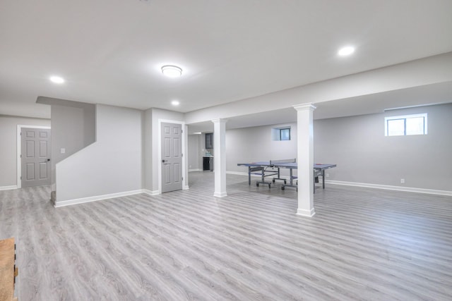 basement with light wood-style floors, baseboards, and recessed lighting