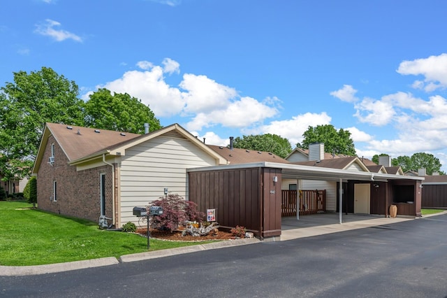 8542 Sawyer Brown Rd, Nashville, TN 37221 - exterior space featuring a yard and brick siding