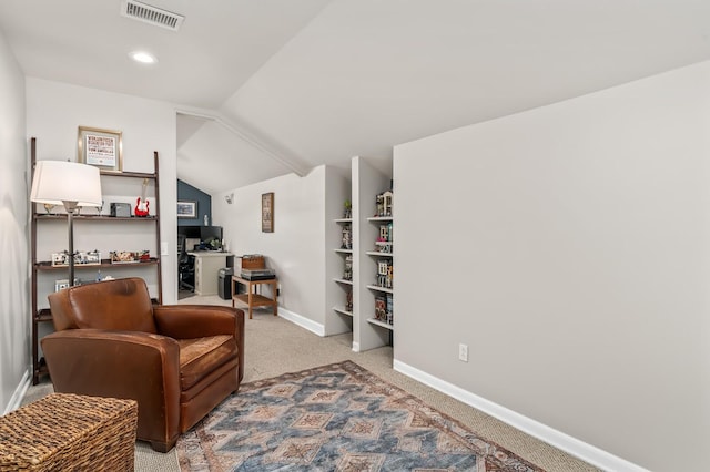 8542 Sawyer Brown Rd, Nashville, TN 37221 - living area with visible vents, baseboards, built in shelves, carpet, and vaulted ceiling