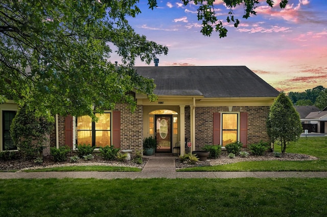 8542 Sawyer Brown Rd, Nashville, TN 37221 - single story home featuring brick siding, roof with shingles, and a front lawn