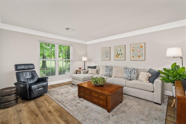 8542 Sawyer Brown Rd, Nashville, TN 37221 - living room featuring crown molding, baseboards, visible vents, and wood finished floors