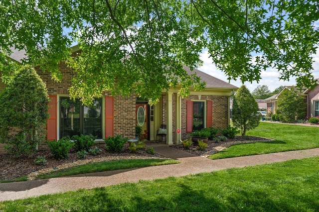 8542 Sawyer Brown Rd, Nashville, TN 37221 - view of front of property featuring a front lawn and brick siding