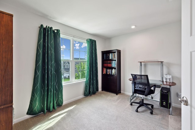 home office featuring baseboards and carpet