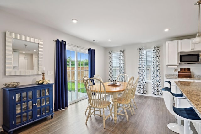 dining space featuring recessed lighting and wood finished floors