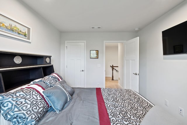 bedroom featuring visible vents and carpet floors