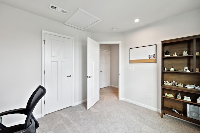 office featuring visible vents, light carpet, baseboards, attic access, and recessed lighting