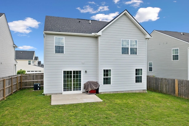 back of property featuring a fenced backyard, a patio area, and a yard