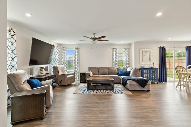 living area with recessed lighting, ceiling fan, and wood finished floors