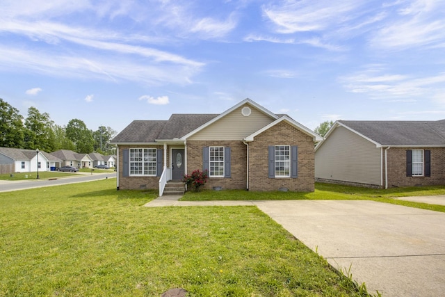 ranch-style home featuring brick siding, crawl space, and a front yard