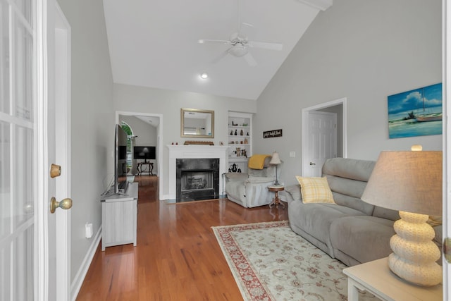 13 Hosier Ct, Lebanon, TN 37087 - living area featuring ceiling fan, built in shelves, wood finished floors, a high end fireplace, and baseboards