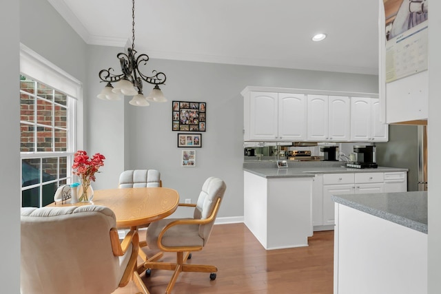 13 Hosier Ct, Lebanon, TN 37087 - dining space with light wood-style floors, crown molding, a chandelier, recessed lighting, and baseboards
