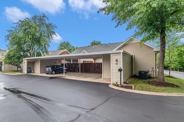 13 Hosier Ct, Lebanon, TN 37087 - view of front of home with fence, central AC unit, and covered parking