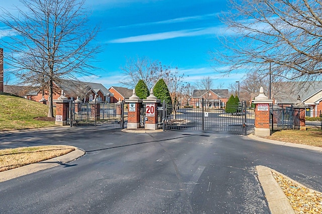 13 Hosier Ct, Lebanon, TN 37087 - view of asphalt street with a gate, a residential view, curbs, and a gated entry