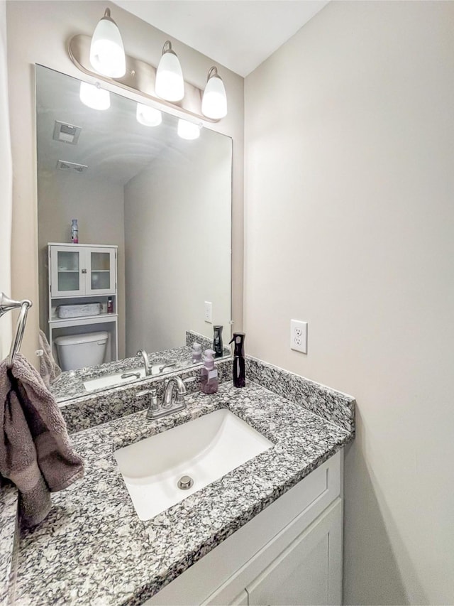 7025 Magnolia Crossings, Spring Hill, TN 37174 - half bathroom featuring toilet, vanity, and visible vents