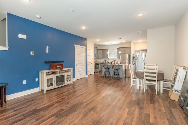 7025 Magnolia Crossings, Spring Hill, TN 37174 - living area with dark wood-type flooring, baseboards, and recessed lighting