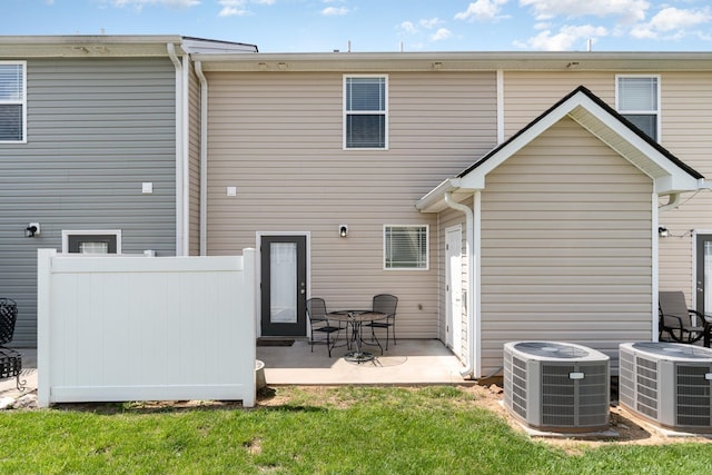 7025 Magnolia Crossings, Spring Hill, TN 37174 - back of property with fence, a patio, cooling unit, and a lawn