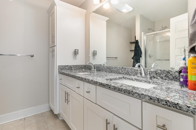 7025 Magnolia Crossings, Spring Hill, TN 37174 - full bath with baseboards, double vanity, a sink, and a shower stall