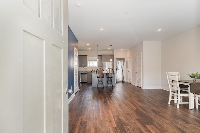 7025 Magnolia Crossings, Spring Hill, TN 37174 - living area featuring dark wood-style floors and recessed lighting