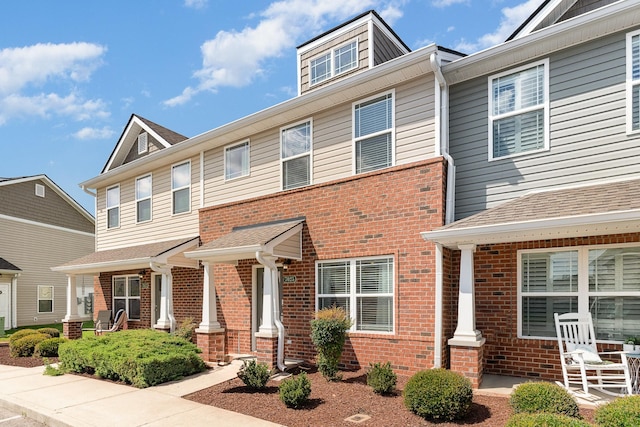 7025 Magnolia Crossings, Spring Hill, TN 37174 - townhome / multi-family property featuring brick siding and a porch
