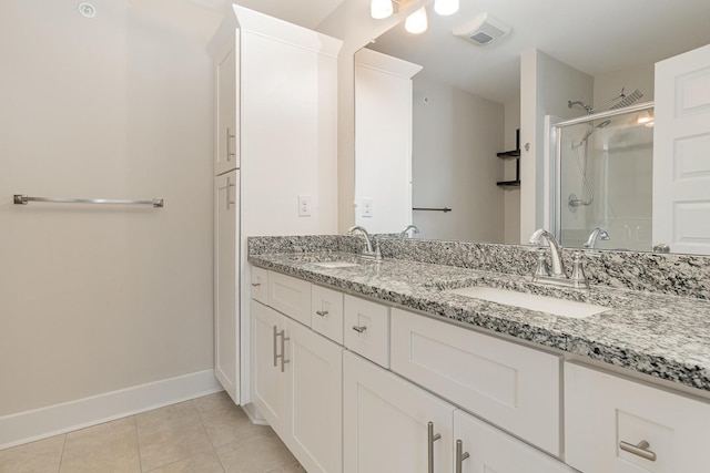 7025 Magnolia Crossings, Spring Hill, TN 37174 - bathroom featuring double vanity, a stall shower, and tile patterned floors