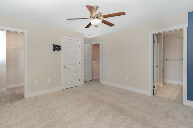 7025 Magnolia Crossings, Spring Hill, TN 37174 - unfurnished bedroom featuring carpet, a walk in closet, ensuite bathroom, and a ceiling fan