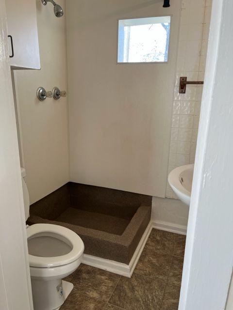 911 Leaf Ave, Murfreesboro, TN 37130 - full bathroom with a shower stall, toilet, and tile patterned flooring