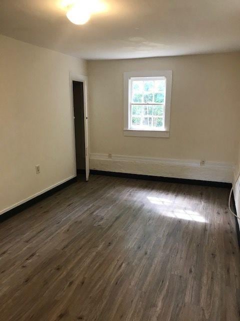 911 Leaf Ave, Murfreesboro, TN 37130 - empty room featuring dark wood-style flooring and baseboards