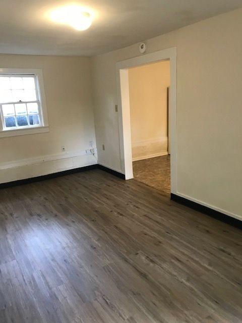 911 Leaf Ave, Murfreesboro, TN 37130 - empty room with dark wood-style flooring, baseboards, and a smoke detector