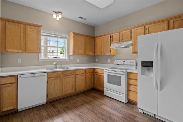 7203 Rosemary Ct, Fairview, TN 37062 - kitchen featuring visible vents, white appliances, light countertops, under cabinet range hood, and a sink