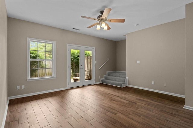 7203 Rosemary Ct, Fairview, TN 37062 - spare room with dark wood finished floors, french doors, baseboards, visible vents, and stairway