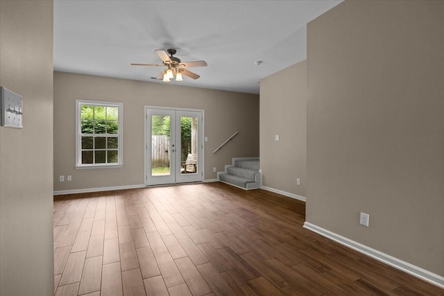 7203 Rosemary Ct, Fairview, TN 37062 - unfurnished living room featuring baseboards, stairs, ceiling fan, and wood finished floors