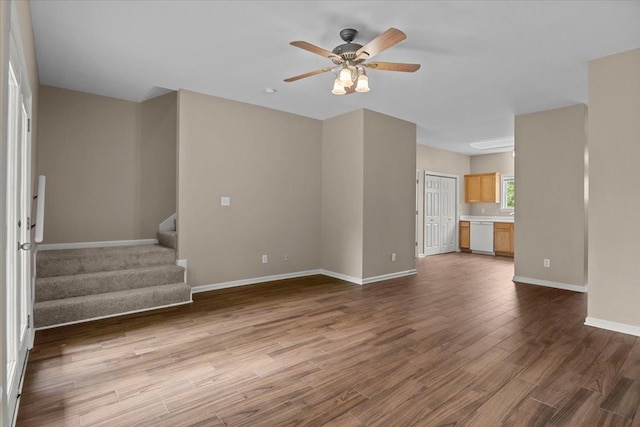 7203 Rosemary Ct, Fairview, TN 37062 - unfurnished living room featuring baseboards, stairs, ceiling fan, and wood finished floors