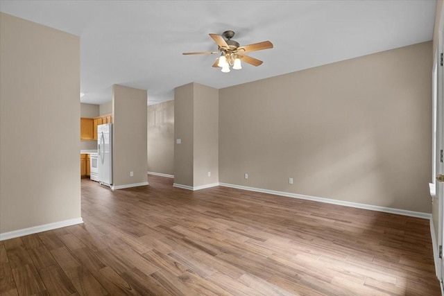 7203 Rosemary Ct, Fairview, TN 37062 - unfurnished living room featuring baseboards, a ceiling fan, and wood finished floors