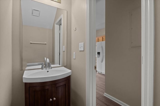 7203 Rosemary Ct, Fairview, TN 37062 - bathroom with vanity, baseboards, wood finished floors, and visible vents