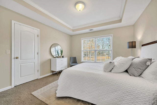 carpeted bedroom featuring a raised ceiling, ornamental molding, baseboards, and visible vents