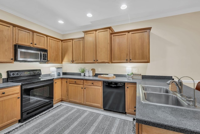 kitchen featuring dark countertops, a sink, black appliances, a peninsula, and recessed lighting
