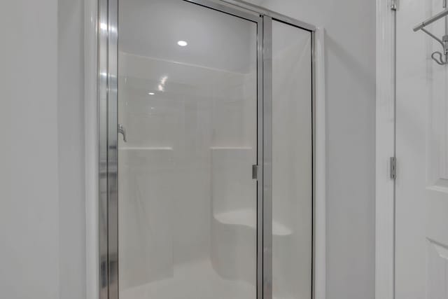 bathroom with a shower stall